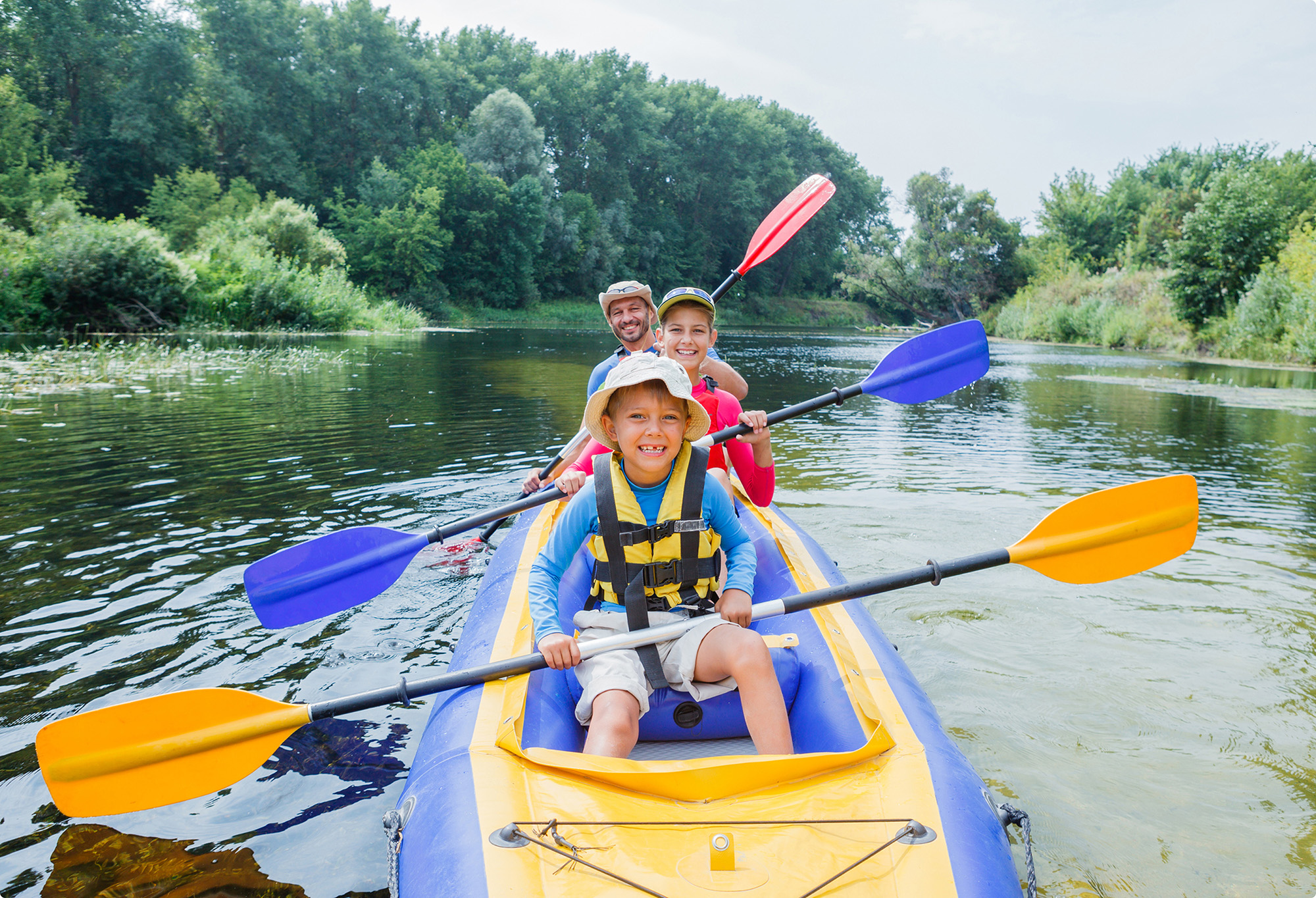 family canoing on a river