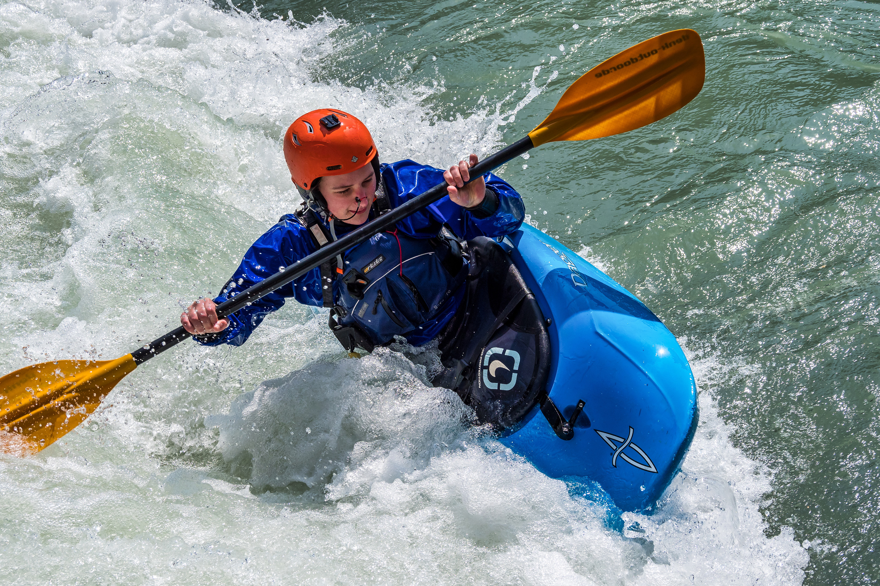 kayaker on river rapids