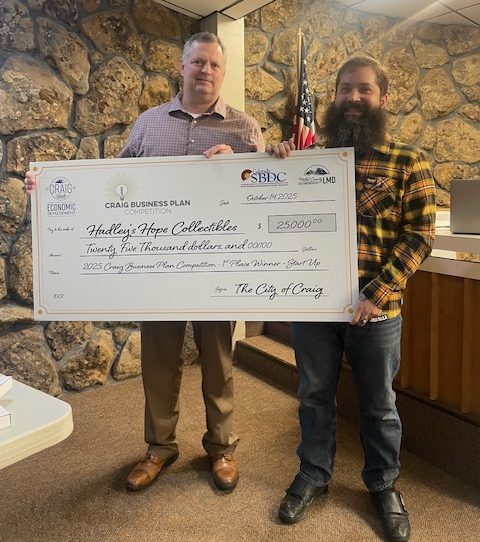 Shaun Hadley, right, receives the $25,000 first-place award in the startup category of the Craig Business Plan Competition. Standing next to him is EDAC Committee Chair and LMD Board Member Chris Jones. This year’s event drew a record 11 participants.